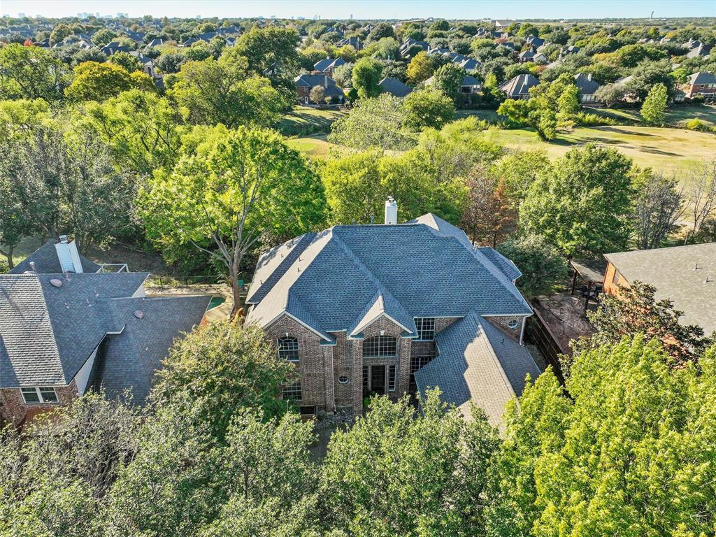Welcome to your dream home in the heart of Plano, where city living meets the tranquility of nature. This 5-bedroom, 4.5-bath home is a true gem, boasting  over 4,650 square feet of fully updated luxury and an inviting pool nestled in a picturesque setting with an abundance of trees that create a serene and private escape. As you step through the front door, you'll be immediately captivated by the spaciousness and timeless design of this home. The open floor plan seamlessly connects the living spaces, creating a perfect flow for both everyday living and entertaining. The hardwood floors and large windows flood the interior with natural light, making it feel warm and inviting. Not only does this property offer the best of nature, but it's also zoned for exemplary Frisco schools. This gated neighborhood features pools, parks, playgrounds, a golf course, and is centrally located providing easy access to shops, restaurants, and major highways. Don't miss the opportunity to make it yours.