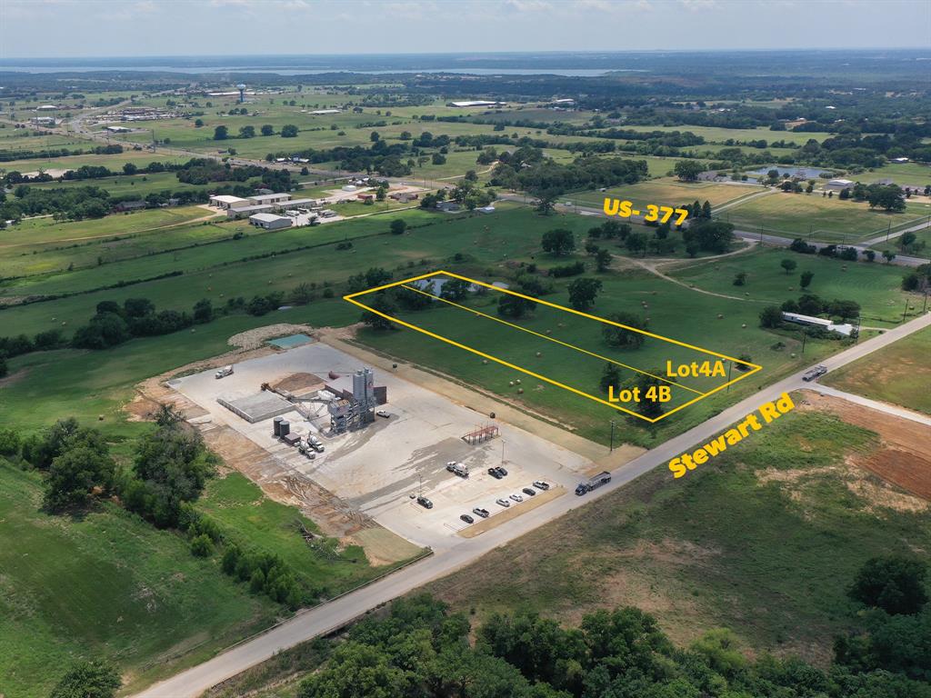 Fantastic opportunity on a major thoroughfare on very rare unrestricted land in Denton County!! Land is outside city limits, but is currently in Krugerville ETJ. Located on Stewart Rd, a heavy duty concrete and curbed road. Land is ideal for light or heavy industrial location, or for your retail store front or business. This is Lot 4B, for a total of 3 acres, an additional 3 acres are available that join this lot for a total of 6 acres. Please ask listing agent for other lots available off Stewart Rd.  Preliminary plat has been submitted to City of Krugerville for approval in January. Sale of lots will be contingent on Krugerville approving this plat revision. US Hwy 377 will be expanding into a divided 6 lane Hwy - please check with TxDot for more information and timeline.  Hard corner of Stewart Rd and US 377 now has brand new 7-11 in place.  Mustang SUD has confirmed 2 inch waterline runs along Stewart Rd and is across the street to the north.  Tons of growth in this area of North Texas!!