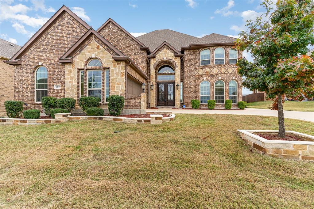 Beautiful and spacious custom home in the desirable Woodbridge neighborhood and Wylie ISD. You will enter into a grand double staircase foyer that is impressive. The open concept layout allows for seamless flow between living room and kitchen that include a large island with granite counters, stainless steel appliance and abundance of cabinets. The primary bedroom and bath along with another bedroom and bath are downstairs.
Upstairs you will find three more bedrooms with ensuite baths a large gameroom and media room with built in beverage bar. Seller will covey the media room projector and screen with acceptable offer.  
The backyard is private and has a large covered patio. This house has it all so don't miss out on this wonderful home in Sachse.