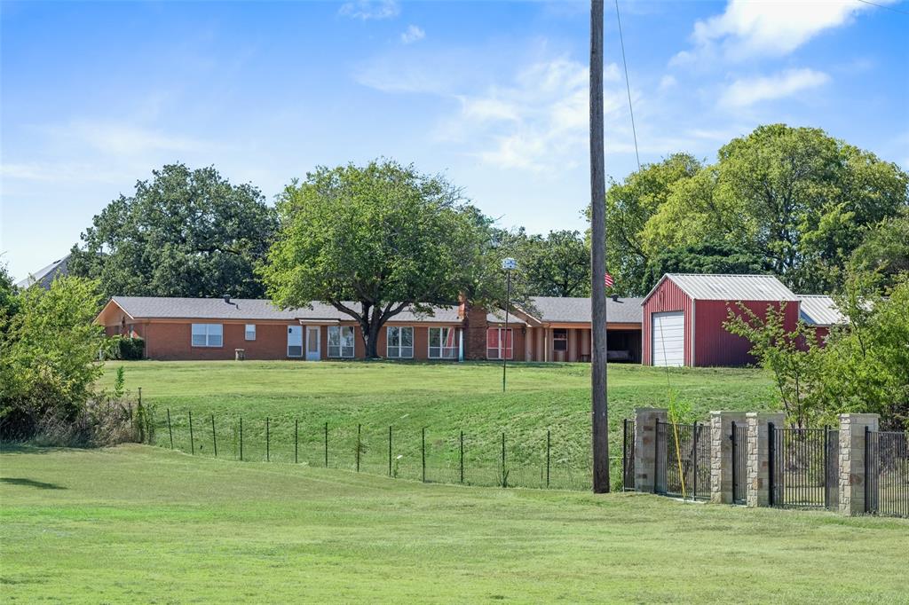 Discover this extraordinary piece of history, held by the same family since 1962. Spanning just under 2 acres, this exceptional property is graced with majestic oak trees, some over 250 years old, offering a serene and private retreat. Nestled in a highly sought-after location, the property boasts a charming single-story ranch home, originally built in 1952, overlooking the scenic Meadowmere Park and Corp of Engineer land. Enjoy the tranquility of your own private pond, while the potential for breathtaking views of Lake Grapevine from a second story adds to the allure. Whether you choose to renovate the existing home, rich with character and history, or bring your own builder to craft a custom masterpiece, this property provides endless possibilities for creating your dream home with unparalleled privacy. Don’t miss this once-in-a-lifetime opportunity to own a truly unique property in a prime location with top-rated Carroll ISD schools.