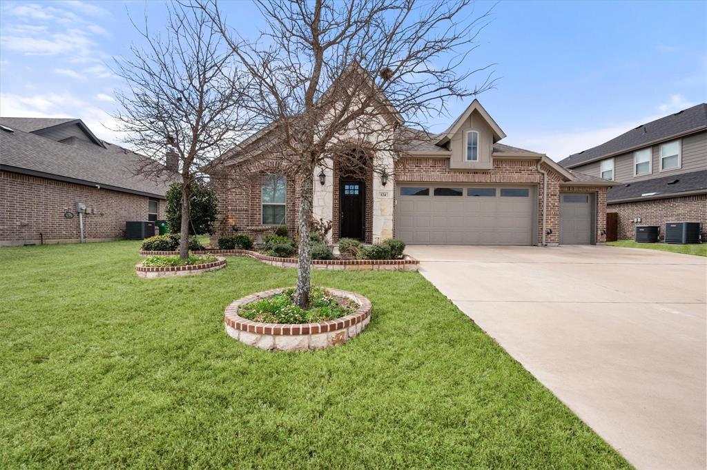 A MUST SEE!! IMMACULATE JOHN HOUSTON CUSTOM HOME in the highly desirable Buffalo Ridge community in Waxahachie. This beautifully designed home features a rare 3-car garage, offering exceptional space for vehicles, recreation storage, Workout gym, or extra living space. Inside, you’ll find 8-foot interior doors, wood flooring, crown molding, and painted cabinetry extending to the ceiling, complemented by a custom backsplash and designer finishes throughout. The inviting living area showcases a raised fireplace with wood skirt, creating a warm focal point for the open-concept layout.  The light-filled kitchen, dining, and living areas flow seamlessly together, making this home ideal for entertaining. The kitchen features an island, ample cabinetry, and a spacious pantry.  The private primary suite offers a relaxing retreat with dual vanities, a glass-framed shower, and a generous walk-in closet.  Step outside to the extended covered patio with an expanded concrete slab, perfect for outdoor dining, relaxing mornings, or evening gatherings. The fully fenced backyard provides privacy and room to enjoy the outdoors.  Located just minutes from elementary, junior high school, theater, local parks and the Waxahachie Sports Complex, Buffalo Ridge residents enjoy community amenities including a pool and playground.  This immaculately maintained, move-in ready home blends style, comfort, and convenience in one of Waxahachie’s most sought-after neighborhoods.  Come check it out!!  It wont last long.