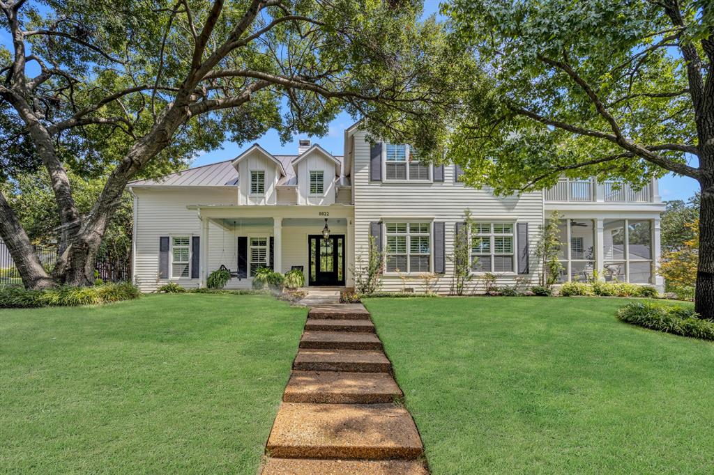 Welcome to Emerald Isle, a charming peninsula community just north of the Dallas Arboretum, offering private access to White Rock Lake. This custom home, built in 2017, is designed with efficiency in mind—no square foot is wasted on unusable space or hallways. The home features four spacious bedrooms, a dedicated study, and three additional living rooms, providing ample space for your family and guests. Situated on just under 0.4 acres, the property boasts four covered patios, including one screened-in, perfect for all your outdoor relaxation needs. The primary bedroom is conveniently located on the first floor, complete with a walk-in closet, separate shower, clawfoot tub, and private patio access. Upstairs, you’ll find three additional bedrooms, each with its own walk-in closet. An additional walk-in closet off the playroom leads to a 798-square-foot attic, offering the potential to easily convert it into a fifth bedroom or media room.