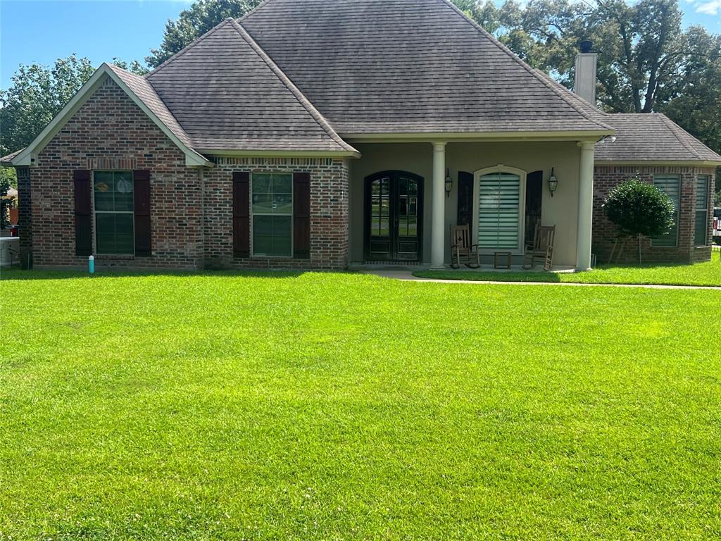 Custom-built home located in the sought-after Forest Hills subdivision in Haughton. This well-designed property offers two spacious living areas, each featuring a fireplace, providing both formal and casual spaces ideal for entertaining and everyday living. The split floor plan includes three bedrooms situated at the front of the home, while the private owner’s suite is located at the rear for added privacy and comfort. Quality craftsmanship is showcased throughout with brick accents, ornate tile work, and granite finishes. The kitchen features a gas cooktop and range, a large center island, and a generous pantry, offering both functionality and style for everyday cooking and gatherings. An upstairs bonus room with a full bath provides flexible use as a fourth bedroom, media room, or additional living space. Exterior highlights include a spacious garage with additional parking, as well as an extended patio complete with a built-in grilling station—perfect for outdoor entertaining. Located in a well-established neighborhood with excellent schools and a strong community atmosphere, this home offers both comfort and convenience. Schedule your private showing today.