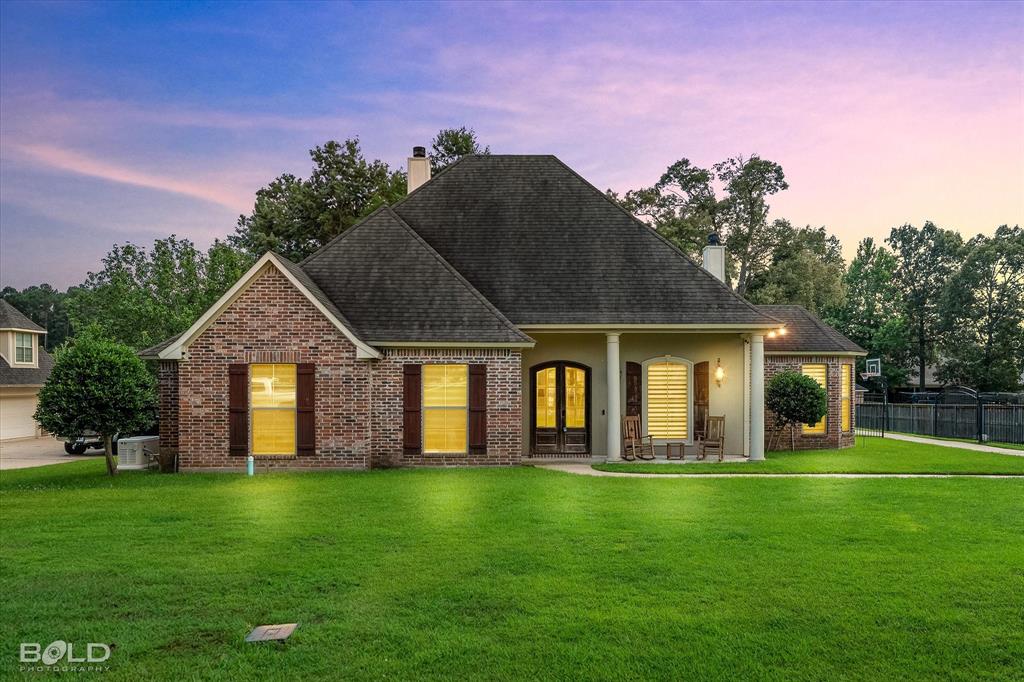 Custom-built home located in the sought-after Forest Hills subdivision in Haughton. This well-designed property offers two spacious living areas, each featuring a fireplace, providing both formal and casual spaces ideal for entertaining and everyday living. The split floor plan includes three bedrooms situated at the front of the home, while the private owner’s suite is located at the rear for added privacy and comfort. Quality craftsmanship is showcased throughout with brick accents, ornate tile work, and granite finishes. The kitchen features a gas cooktop and range, a large center island, and a generous pantry, offering both functionality and style for everyday cooking and gatherings. An upstairs bonus room with a full bath provides flexible use as a fourth bedroom, media room, or additional living space. Exterior highlights include a spacious garage with additional parking, as well as an extended patio complete with a built-in grilling station—perfect for outdoor entertaining. Located in a well-established neighborhood with excellent schools and a strong community atmosphere, this home offers both comfort and convenience. Schedule your private showing today.