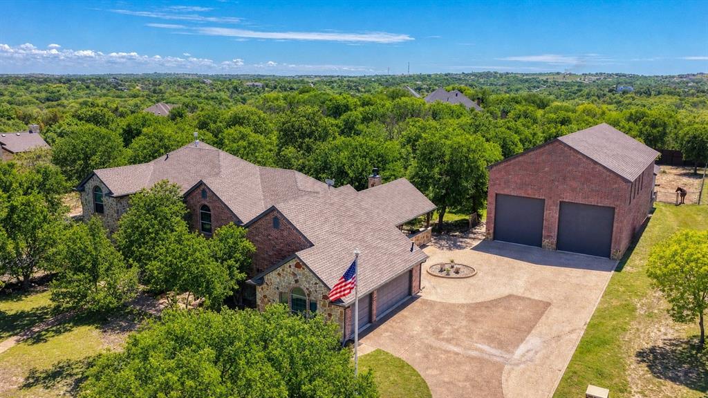 Spacious, upgraded, and built for both lifestyle and functionality, this unique property offers the perfect blend of indoor comfort and exceptional outdoor living. Inside, you’ll find generous living spaces designed for everyday living and entertaining, while the true highlights are outside.

Enjoy your own private retreat featuring a fully equipped outdoor kitchen ideal for hosting year-round. The property is set up for equestrian or hobby farm use with a custom 2-stall horse barn and approximately half an acre of pipe-fenced pasture.

The barn features oversized foaling stalls with custom doors and windows, premium Stall Saver flooring, and plumbing for automatic waterers. It’s prepped for foam insulation, with feed and tack rooms roughed in for HVAC. Additional amenities include a wash rack, multiple water access points, and wide gates for easy equipment and livestock access.

The 36’ x 65’ shop (36’ x 85’ overall with barn) offers incredible versatility with space for a gym or workspace, plus a heavily reinforced safe room with custom safe door and HVAC rough-in. The mezzanine level includes a full bath, wet bar rough-in, and is prepped for HVAC ideal for office or entertainment space.

Built for durability, the shop includes a reinforced slab, added structural supports, separate electrical panel tied to the home and Generac generator, gas lines, lift station, and high-speed internet.

Major 2022 upgrades include Low-E windows, two TRANE HVAC systems with WiFi thermostats, fully encapsulated foam attic, added fresh air vents, WiFi garage doors for home-shop-barn, and a new 30-year composition roof. A Generac whole-home generator provides added peace of mind.

This property offers a rare combination of modern upgrades, land flexibility, and outdoor living—perfect for those looking to live, work, and play in one place.