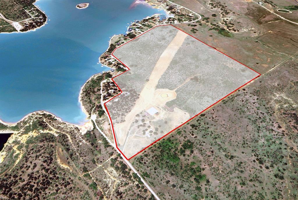 Enjoy flying, fishing, ranching, and more on this 120+- acre ag exempt Lake Graham property. Whether utilizing the 3,100 ft FAA approved runway, the well stocked pond, the lake access or the numerous building on site. The world is your oyster on this site. Would make great for development as well. The property includes the custom 125' x 125' high quality airport hanger with 1,200 sq ft of living area, and 1,200' of mechanical and storage facility enclosed. This hanger features a 65' x 17' hydraulic door and the 15,625 sq ft is clear span to house 15-20 air crafts comfortably. With 29' of center height you can easily house a king air and more. The acreage is cattle ready with adequate water sources and power. If flying is not your desire then development or even a fly in community. Let your imagination run wild on this rare lakeside property.