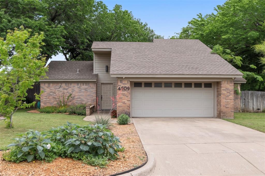 PRICE IMPROVEMENT! Welcome home to this charming 2-bedroom, 2-bathroom retreat nestled on a quiet cul-de-sac in one of Fort Worth's most established neighborhoods. The split-bedroom floor plan offers privacy and functionality, with each bedroom featuring its own attached full bathroom!
The warm and inviting living area is anchored by a wood-burning fireplace elegantly accented with gray tile and surrounded by built-ins. The quaint kitchen features abundant cabinetry, a breakfast bar, plant ledges, and ceramic tile countertops with a coordinating backsplash. 
Out back, enjoy an oversized partially covered wooden deck perfect for relaxing or entertaining under the Texas sky.
Located just minutes from the highly regarded Meadowbrook Golf Course, nearby Oakland Lake Park with its walking trail, playgrounds, and skate park, and with easy access to I-30 and Downtown Fort Worth. This established neighborhood offers mature trees, character, and community. Don't miss this one!
Ask about the exclusive 3% back grant this home qualifies for — a rare opportunity to make your move even smarter.