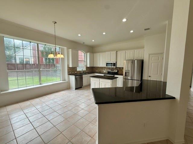 Discover this beautifully maintained single-story home tucked away on a quiet cul-de-sac in the heart of Highland Village. Thoughtfully designed with a split-bedroom layout, this residence offers both privacy and comfort, enhanced by soaring ceilings, crown molding, and abundant natural light throughout. The elegant formal living and dining rooms create a welcoming first impression, while the cheerful island kitchen—complete with a breakfast bar, eat-in nook, and views into the family room—makes everyday living effortless. The spacious family room features walls of windows overlooking the serene backyard, creating a peaceful backdrop for gatherings or quiet evenings at home. The generous primary suite includes a tray ceiling, dual vanities, a jetted tub, separate shower, and a large walk-in closet. The fourth bedroom offers flexibility as a private home office or study. Step outside to an expansive backyard with lush grass, mature landscaping, and charming herb and flower gardens—a perfect retreat for bird watching, play, or outdoor entertaining. A covered patio provides shade and comfort year-round. Located in the desirable Briarhill Estates, this home offers walkability to trails, parks, and shopping, plus access to top-rated Lewisville ISD schools including Heritage Elementary, Briarhill Middle, and Marcus High School.