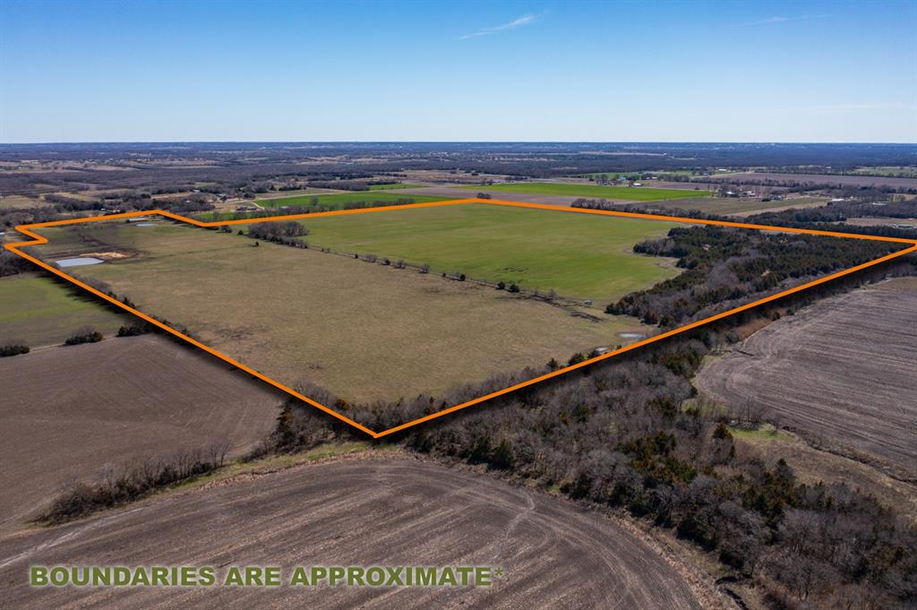 Fenced Pasture for cattle with barn and pond. Old Homesite with a few mature trees and a water meter in place. Level cropland and an area of thick trees in the back corner. This property has beautiful views in all directions. This can become your homestead and enjoy years of farming and ranching or develop into a residential subdivision.  There are a lot of possibilities for this area. Located outside of the city limits and ag exempt. Property is currently leased for cattle and crops and the lease can continue to keep the lower taxes if the new owner desires that. Finding properties over 100 acres for residential use are becoming harder to find and this one will check off so many boxes as far as meeting your requirements.