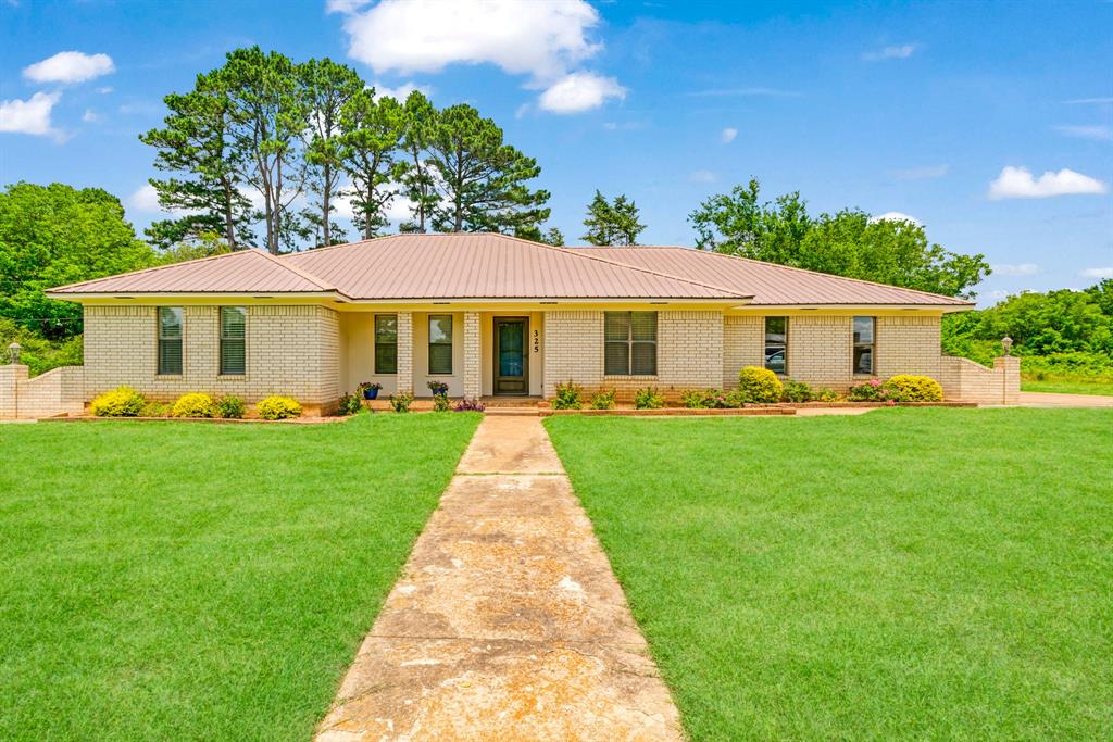 Welcome to this beautifully maintained 3-bedroom, 2-bath home offering comfort, functionality, and a peaceful setting just minutes from town. Featuring a durable metal roof and numerous recent updates, this move-in-ready property showcases pride of ownership throughout.  
Inside, you'll find a well-cared-for interior designed for everyday living and entertaining. Outside, the spacious fenced backyard provides plenty of room for pets, play, gardening, or relaxing evenings outdoors.  Additional highlights include a two-car garage and a metal shop, perfect for hobbies, storage, equipment, or a home-based business. Nestled in a quiet location, this property offers the best of both worlds—country-style tranquility with convenient access to shopping, dining, schools, and everyday amenities just minutes away.  
Whether you're looking for extra workspace, outdoor space, or simply a well-maintained home in a desirable setting, this property checks all the boxes. Don't miss your opportunity to make this exceptional home yours!