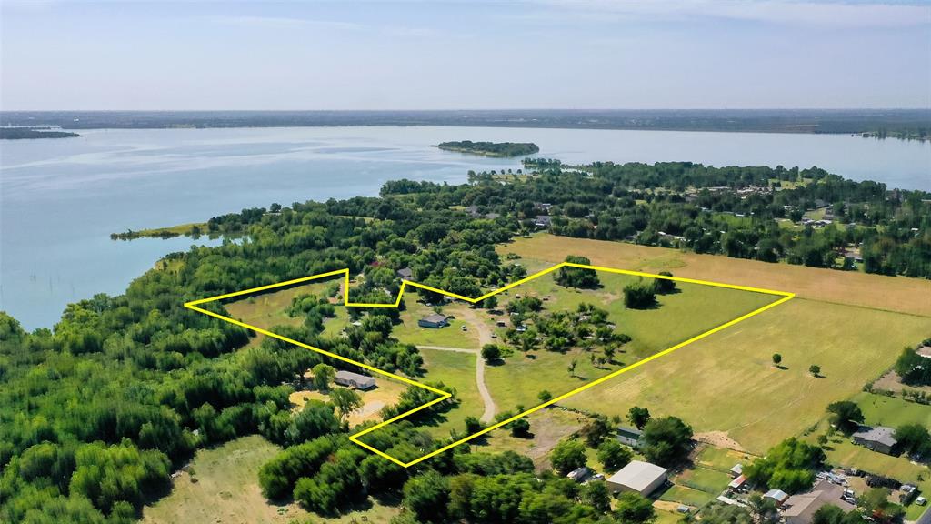 Rare and Unique Opportunity Near Lake Lavon! This is a rare chance to own 13.4 acres of beautiful, gated land just minutes from Lake Lavon. Whether you're looking to build your dream home, develop multiple residences, or simply enjoy the space as it is, this property offers endless potential. With five septic systems already in place, it's an excellent opportunity for developers or those seeking multigenerational living.
The recently remodeled home, updated in 2023, features 2,120 square feet of spacious and flowing living space. It offers three large bedrooms and two full bathrooms. The living room is expansive and welcoming, complete with built-in shelving. The eat-in kitchen includes a breakfast bar, plenty of cabinetry and counter space, and opens to a formal dining room perfect for entertaining.
The primary suite boasts two walk-in closets and a private ensuite bath. The second bedroom also includes a walk-in closet, and the home offers a large utility room with built-in cabinets for added storage.
Additional highlights include RV parking, two storage sheds, and a guest house on the property, providing even more flexibility and space. Whether you're looking for peaceful country living or a unique investment, this one-of-a-kind property delivers.