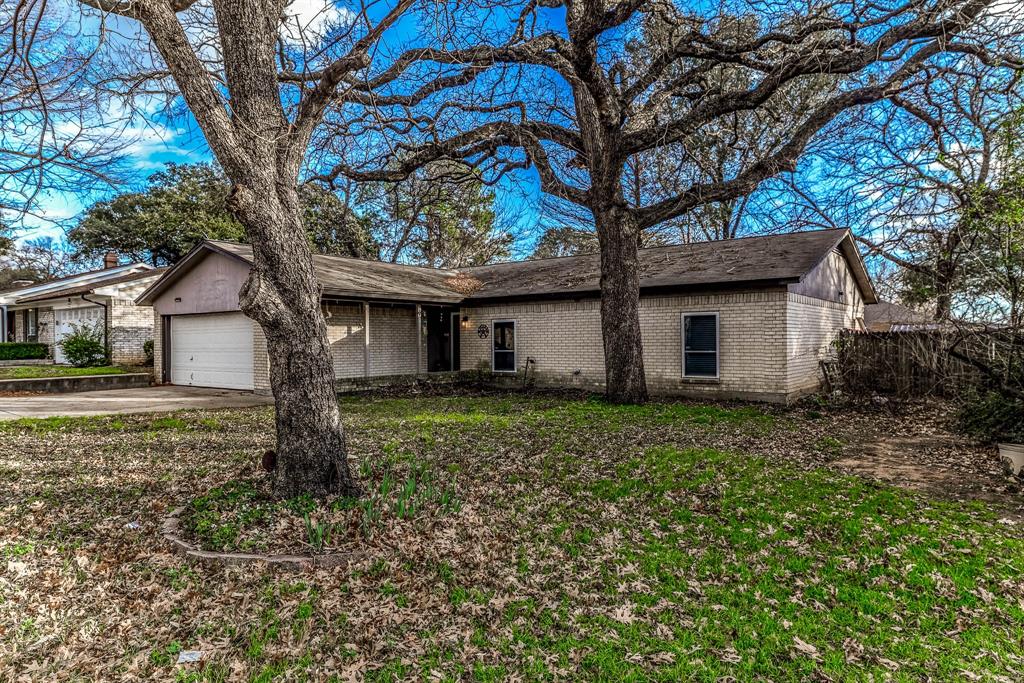 Welcome home to timeless charm, endless possibilities, and the freedom of an established Arlington neighborhood with no HOA. This inviting 3-bedroom home offers space to spread out, featuring a large backyard and a versatile bonus room created from a partial garage conversion—ideal as a fourth bedroom, home office, playroom, or creative studio, all connected to the home's HVAC system for year-round comfort.  Inside, you'll find a cozy fireplace, built-in bookcases filled with character, a wet bar ready for entertaining, and French doors that open to the patio, creating the perfect setting for morning coffee, weekend barbecues, or relaxing evenings outdoors. Ceiling fans, generous storage, and thoughtful living spaces add everyday convenience. Conveniently located near I-20 and I-30, you'll enjoy easy access to shopping, dining, entertainment, and major commuting routes. Solar panels help keep energy costs manageable, while a little TLC offers the opportunity to add your own style and build instant equity. Filled with warmth, character, and potential, this is the kind of home where memories are waiting to be made. Come see it for yourself and imagine all the possibilities!
