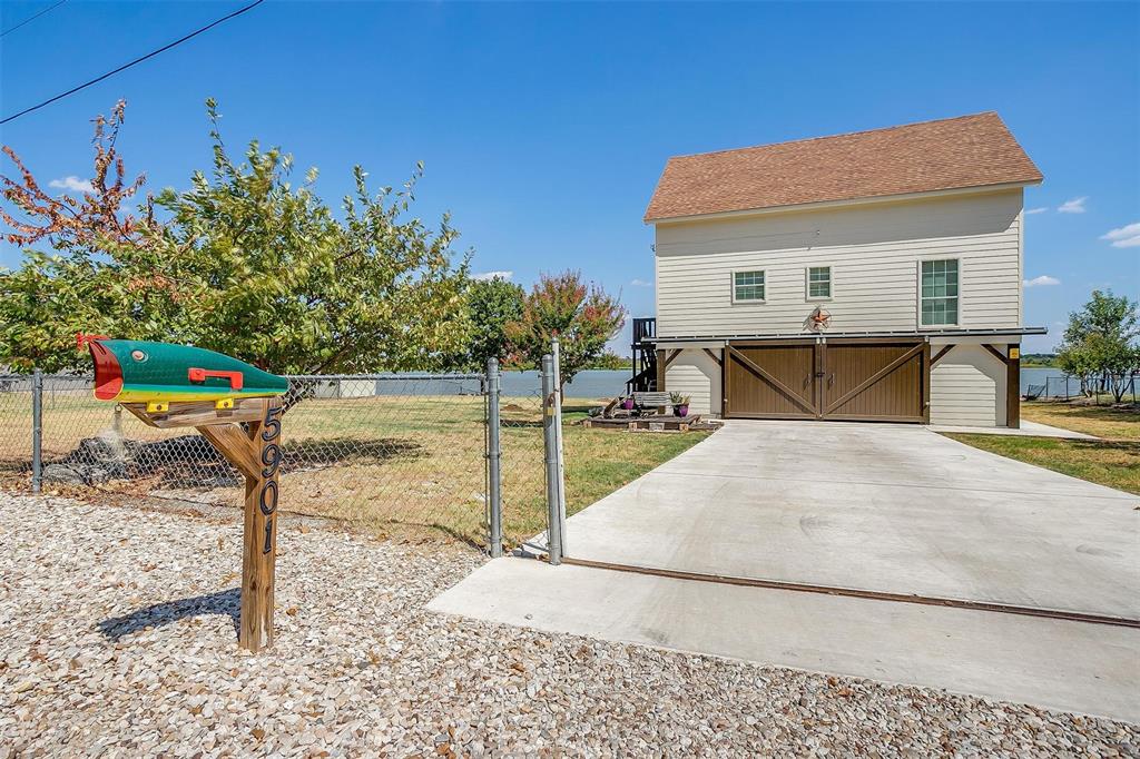 **ABSOLUTE FISHERMAN’S PARADISE on Lake Granbury!** SOLICE & SERENITY awaits you... Wake up to gentle waves and endless blue skies at this stunning, modern, & classic coastal-inspired elevated lakefront home PERFECTLY situated at the end of a private Cul-de-sac adjacent to the mouth of the Brazos River! Imagine quiet mornings on the water, afternoon boat rides right from your backyard, or simply relaxing under the Texas sun with breathtaking views that NEVER get old. This BEAUTY offers 3 Accessible levels: a Top floor which includes 3 bedrooms, Utility closet, and a loft; a Second level which includes an Updated Kitchen with NEW Granite countertops, New Tile flooring throughout entire level, New Microwave, New Dishwasher, utility room for washer & dryer, and a private den; Lastly, the Primary Level which opens up on 2 sides with sliding barn doors for added privacy or an ever-flowing breeze, which makes PERFECT as a covered patio deck with a built in Safe room or utility Closet. Whether you're retiring in style, seeking a peaceful vacation getaway, embracing an active lakeside lifestyle, or looking for a turn-key Air B&B Favorite producing $30k annually as an investor-- this property delivers privacy, space, and that coveted on the water feeling every single day!!! Modern, move-in ready, and positioned perfectly for the best breezes and views that can't be beat; Your next chapter of relaxed, waterfront living starts here. Schedule your private tour today, this one won't last long!!! ***SELLER IS NOW OFFERING $7K TOWARDS CLOSING COSTS!!***