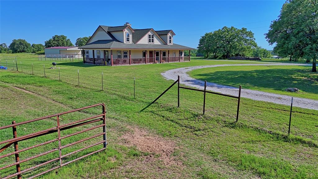 Motivated Sellers with a Beautiful 14± acre horse property in Bowie and a custom 2,300± sq ft home built in 2006, about an hour to Ft Worth, Denton or Wichita Falls. This inviting property offers hay-producing pasture, no-climb and pipe fencing, a 30x50 insulated shop with electric and HVAC, and a loafing barn with two 15-ft stalls—perfect for horses and equipment. The home is also equipped with paid-off solar panels, providing excellent energy efficiency and noticeably lower electric bills.

Inside, the open kitchen features custom pecan cabinets, granite countertops, a butcher-block island, ceramic farmhouse sink, gas cooktop, and double oven. The kitchen flows into a warm, spacious family room with vaulted ceilings, built-ins, and a stunning rock wood-burning fireplace with gas starter and dedicated firewood storage. It’s a true WOW moment when you walk in.

The home includes 3 bedrooms, 2 bathrooms, and a versatile media room with built-in surround sound. The primary suite offers a large bedroom, luxurious bath with double vanities, walk-in shower with multiple shower heads, a garden tub with countryside views, and a huge walk-in closet. The well-designed laundry room includes a sink, abundant cabinetry, space for a deep freeze, a skylight, and convenient access to both the master closet and garage.

Additional features include hardwood floors throughout most of the home, propane heat, two HVAC units, two hot water heaters, attic access in the master closet and garage, and a Class 4 roof replaced in 2008. The insulated well house sits on a slab for added durability.

Enjoy peaceful views from the large front porch that wraps around to the side of the home. The circle drive is wide enough for trailers, making hauling horses or equipment easy. The fenced backyard provides secure space for pets and family.

This property blends comfort, craftsmanship, and country living. A rare find with room to roam. Schedule your showing today.