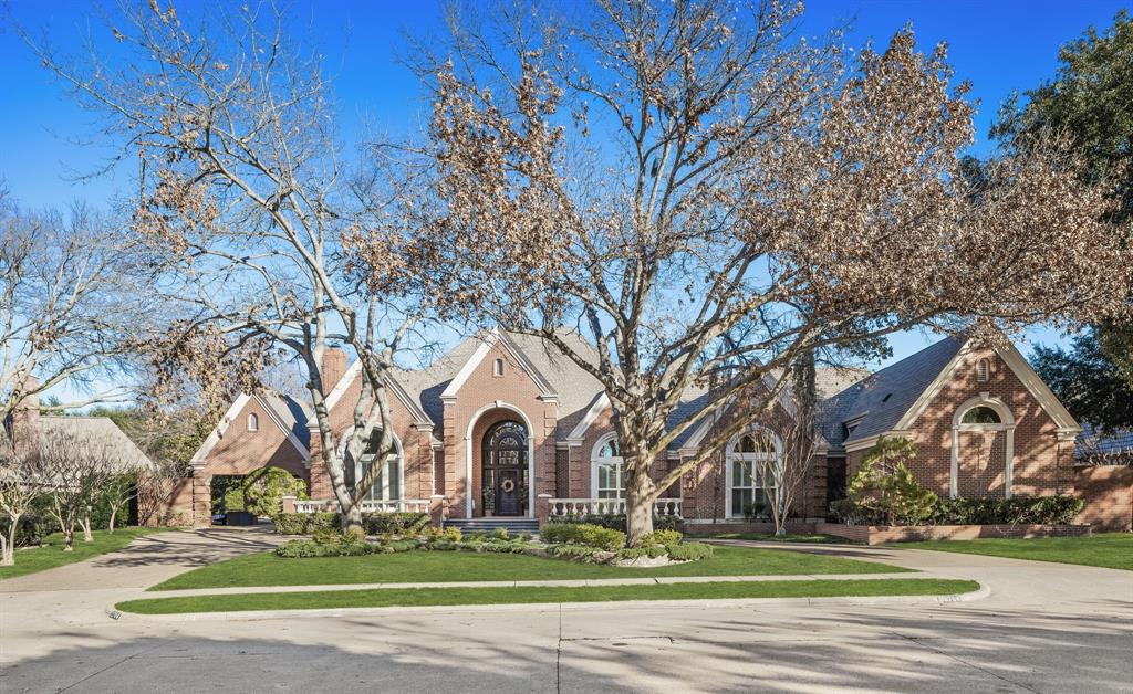 Gorgeous transitional estate on sprawling .6 acre lot with rare 4 car garage! Featuring high ceilings, designer finishes, hardwood floors, and walls of windows throughout, this stunning home is one of sought after Willow Bend Lakes finest! Downstairs offers two spacious living rooms each with fireplaces and built-in bars, perfect for the entertainer! Gourmet chefs kitchen with large butlers pantry and dual dishwashers! The floor plan centers around the breathtaking outdoor oasis, offering views from every room! Backyard is complete with a recently remodeled pool & spa, putting green, 2 large covered patios with electric screens, a fire pit and massive tree lined yard offering plenty of privacy! Retreat to the primary suite with luxurious spa like bath and oversized walk-in closet! Downstairs also offers a gorgeous study, two additional bedrooms, dining room, & laundry room with mud bench! Two large bedrooms and a flexible media or game room up! All bedrooms complete with ensuite baths! Expansive courtyard with porte cochere for additional covered parking! Zoned for West Plano ISD!
