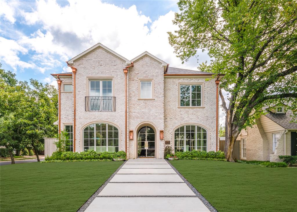 This elegant 5,659 sq ft new construction by Prous Homes offers timeless design and exceptional craftsmanship in the heart of Highland Park. Ideally located just a short walk from Bradfield Elementary, Highland Park Village, and the Dallas Country Club, the home features 5 bedrooms, all ensuite, along with 6 full baths and one half bath.
Inside, the chef’s kitchen is outfitted with a 48” Sub-Zero refrigerator and freezer, Wolf appliances, Taj Mahal Quartzite countertops, and a spacious walk-in pantry. A stylish bar and lounge area with a Sub-Zero wine fridge and ice maker connects the study or formal living space to the warm and inviting family room, which showcases a hand-carved limestone fireplace and wood beam accents. The living room features a striking black marble fireplace and grasscloth wall covering, adding texture and elegance.
The main level also includes a mudroom off the garage and an office tucked just off the kitchen. Outdoor living is seamless with a patio and fireplace for year-round enjoyment. White Oak floors run throughout the home, complemented by curated lighting and high-end finishes.
The second floor offers four bedrooms, including a luxurious primary suite with an oversized walk-in closet, a large game room, and a generous laundry room. The fifth bedroom is located on the third floor, offering flexibility for guests, a home office, or gym.
This beautifully designed home blends sophistication and comfort in one of Dallas’s most desirable neighborhoods.