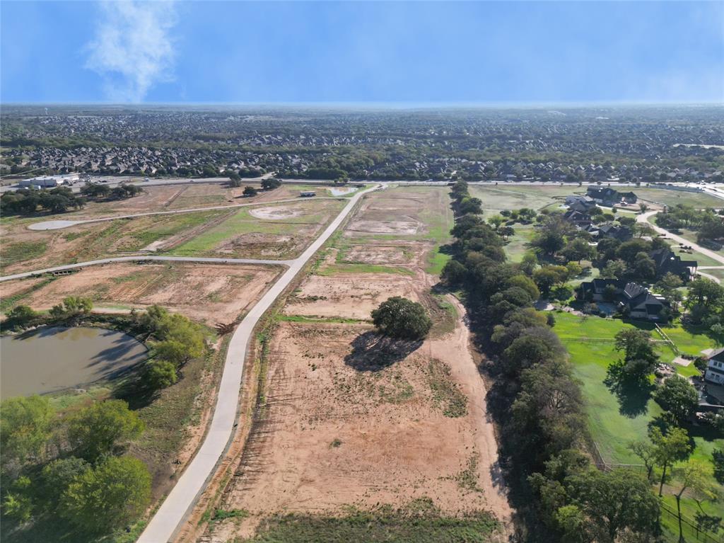 Welcome to your dream estate where you can BRING YOUR OWN BUILDER. Spanning on an impressive 2.01 acres, this lot offers endless possibilities for creating your own oasis. This lot blends spacious acerage living with the luxury of living in a premium subdivision. Eagles ridge is 38 two acres+ lots spread out over an ample 87-acre development with views of large natural ponds, and beautiful old native trees. Choose your builder and build your dream home within the highly sought after and exemplary Argyle ISD school district and close to Liberty Christian, one of DFW's top private schools. Eagles Ridge is Bartonville's newest subdivision, a serene small-town haven while being just minutes from the bustling Highland Village and major thoroughfares for easy access to shopping, dining, entertainment, and several golf courses just around the corner. Great location between Grapevine Lake and Lewisville Lake, you can't pick a better spot to have a small-town atmosphere and city convenience!