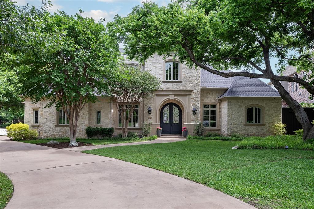 Recently transformed by an approximately $1M total remodel, this Preston Hollow residence showcases exceptional designer finishes and thoughtful upgrades throughout. Interiors were extensively renovated circa 2025 by renowned builder Ellen Grasso, complemented by a complete pool overhaul featuring new surfacing, updated tile, a spa addition, tranquil water features, and a resistance swim jet - creating a true private resort experience.

Set on a large, quiet corner lot and framed by mature specimen trees, the property backs directly to the Northaven Trail, offering immediate access for walking and cycling all the way to White Rock Lake - an exceptional blend of privacy and connectivity.

Designed for both grand entertaining and effortless daily living, the light-filled open floor plan features soaring ceilings, expansive windows, and seamless indoor-outdoor flow. The open kitchen and living area overlook a covered terrace, a beautifully landscaped backyard, and the remodeled pool, spa, and putting green. The gourmet kitchen is a chef’s dream with a 9-burner Wolf range, dual dishwashers, an oversized island, and an extraordinary walk-in pantry.

The main-level primary suite offers a spacious sitting area and spa-inspired bath with steam shower, soaking tub, dual vanities, and a custom walk-in closet with washer-dryer connections. A downstairs guest suite provides comfort for visitors, while four additional ensuite bedrooms upstairs – all with designer finished bathrooms - offer flexibility for office, fitness, or media space, along with a large game room.

A circular drive leads to both a two-car and separate one-car garage. A timeless stone façade ensures enduring curb appeal, pairing classic architecture with today’s most desirable modern updates.  Ideally located in the heart of Preston Hollow, this updated home at a compelling price is just minutes from top private schools, along with premier shopping and dining destinations.
