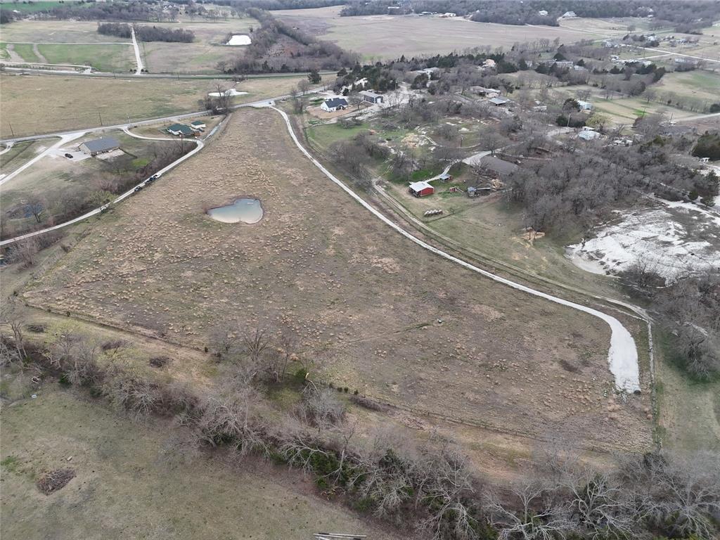 **AG EXEMPT** Build your dream home on 10.5 acres in the heart of Van Alstyne — a rare, ready-to-build property offering privacy, wide-open space, and modern convenience. Situated outside city limits, this blank canvas comes equipped with underground utilities, recently installed underground electric, an aerobic septic system, RV hookup, and a gravel driveway with an automatic gate — saving you time, effort, and expense as you start building. In Van Alstyne ISD. 

Imagine creating your private country retreat, a custom estate, or a sprawling outdoor oasis for family, recreation, or even horses. With room to spread out, the property provides unmatched flexibility for your lifestyle and vision.

Located within a highly rated school district and just minutes from town, this acreage combines country tranquility with easy access to shopping, dining, and everyday conveniences. Don’t miss this opportunity to own a prime piece of Van Alstyne countryside with infrastructure already in place and endless possibilities.