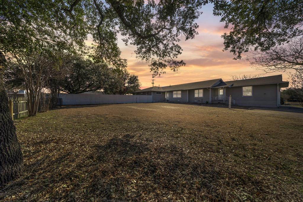 LOOKING FOR SPACE ON A BUDGET?! Come see this move-in-ready 3000+ sqft AFFORDABLE home on a spacious .84 acre lot with quick access to I-35!  Room everyone AND gathering with 2 living areas, 2 dining areas, PLUS Sunroom, 4 Bedrooms, 3 and a half baths, and a 2 car garage!  Extra large rooms throughout with walk in closets and plenty of quality built ins- ideal for those in need of storage.  Privacy fenced back yard with a gazebo and garden area is made for those who like to spend time outdoors. The cook will appreciate all the cabinetry and countertop space in the kitchen for storing equipment and creating dishes! Well suited for multigenerational living with 4 exterior doors for added functionality and convenience. Located within city limits on a quiet dead-end road across from a vacant school building, this property offers a rare combination of accessibility and privacy. Floor plan layout attached in photos!