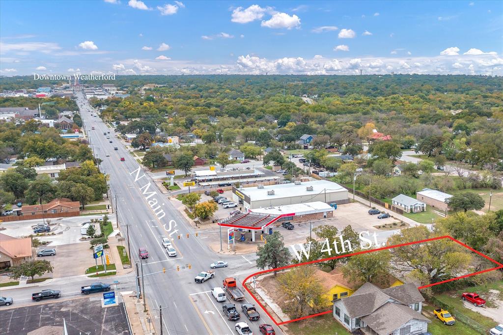 Fabulous Corner Lot at the busy intersection of North Main Street and 4th Street with an estimated traffic count of 2,000 cars per day.  Building has approximately 1,653 square feet with lots of character and updates including HVAC.  Spacious parking lot with ample parking available.  City Requirements for curbs and sidewalks were complete in 2022.  Storm Shelter on property.  Owner Financing Available.