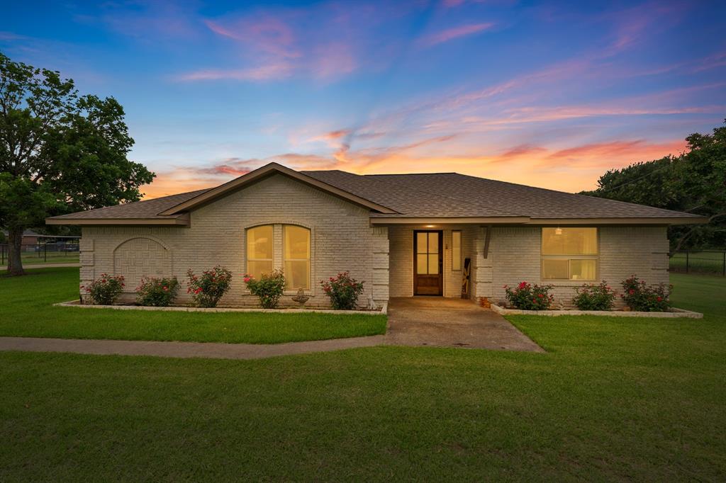 The private gated driveway sets the tone before you ever reach the front door. The setback is exceptional, the kind that makes you slow down, and the German schmear brick paired with freshly landscaped flower beds makes this one of the most inviting homes on the street. Then you see the mahogany front door and you know the inside is going to match. This home has been comprehensively updated in 2025 with finishes that belong in a custom build. The kitchen is the centerpiece: custom cabinetry, Taj Mahal quartzite countertops, and new lighting that makes the space feel warm and intentional. Every detail was chosen. Porcelain tile flooring flows throughout, grounded by new 6-inch baseboards and custom accent walls. New solid-core doors, fresh tape, bed, and texture mean there are no shortcuts hiding behind the beauty. New trim, paint, and lighting complete a transformation that is genuinely move-in ready from day one. Both bathrooms have been completely reimagined with designer finishes and frameless shower glass, creating spa-like spaces that feel like a retreat. The family bonus room offers the flexibility your family actually needs: playroom, home office, media room, or second living area. The big-ticket items are done. Roof replaced March 2024. Presidential windows within the last four years. You are not buying a project. You are buying peace of mind and a home ready to be lived in and loved. Homes updated at this level with a private gate and this kind of street presence do not come available often. Come see it and you will understand why.