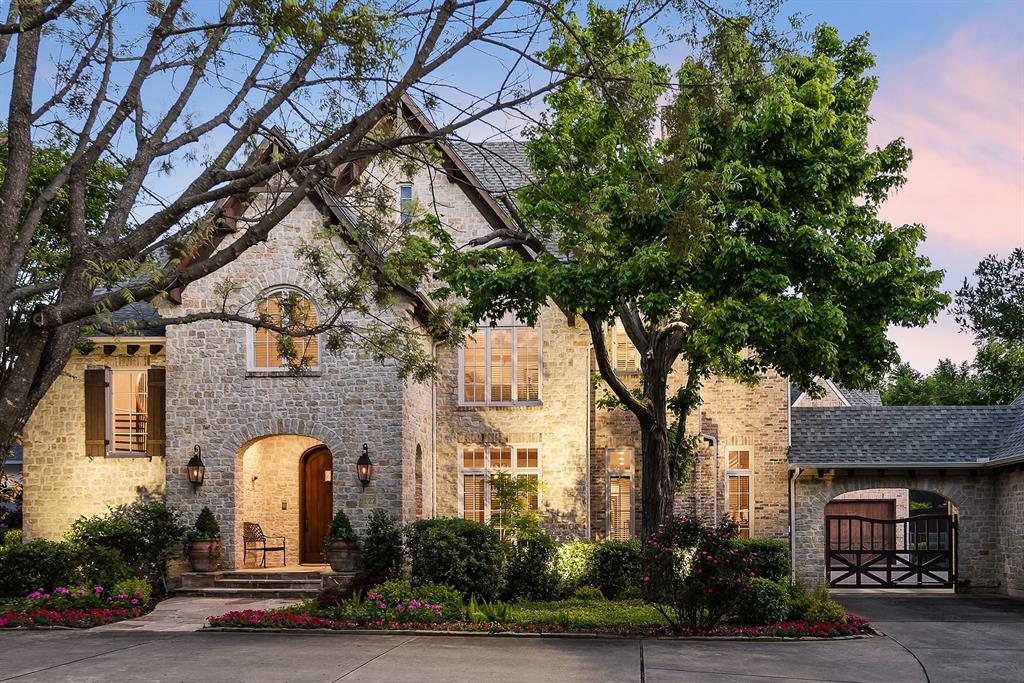 Beautiful storybook Tudor on Norway. Living room with 12’ ceilings. Wet bar. Large wine room. Spacious dining room. Wonderful flow for entertaining. Gourmet kitchen with island & window overlooking motor court. Keeping room with charming fireplace could be breakfast room or furnished with comfy chairs for morning coffee. Downstairs primary suite includes remodeled bath, large closet, private study & bonus room for exercise, nursery, etc. Upstairs has 4 ensuite bedrooms, large craft closet, study space with 3 desks, & gameroom with ample light. Go up 3 steps into incredible 450 sqft storage deck. Outside relax by the pool with spa, practice your putting on the green, and still enjoy ample grassy space.