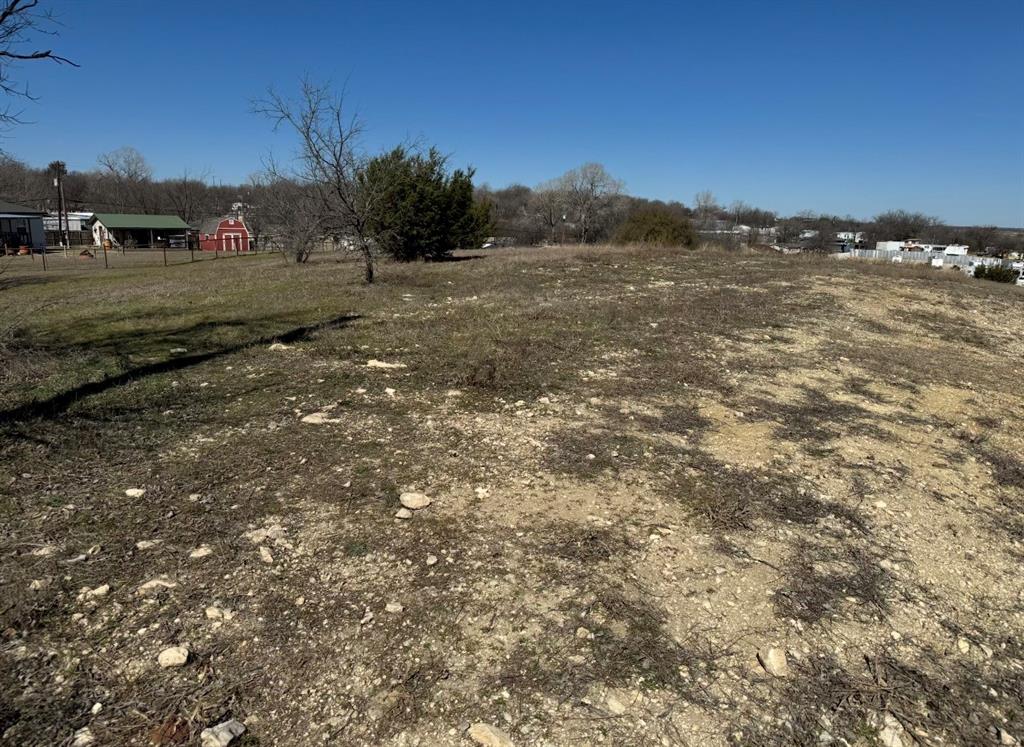 3.234 acres located in Aledo ISD. This property is perfect for a homesite or small development. Central State Water Resources is currently the water and sewer company.   Electric is either Tri-County Electric or of your choice.  Owner has already had drawings for self storage building, layout in submittals.  No Sign on Property