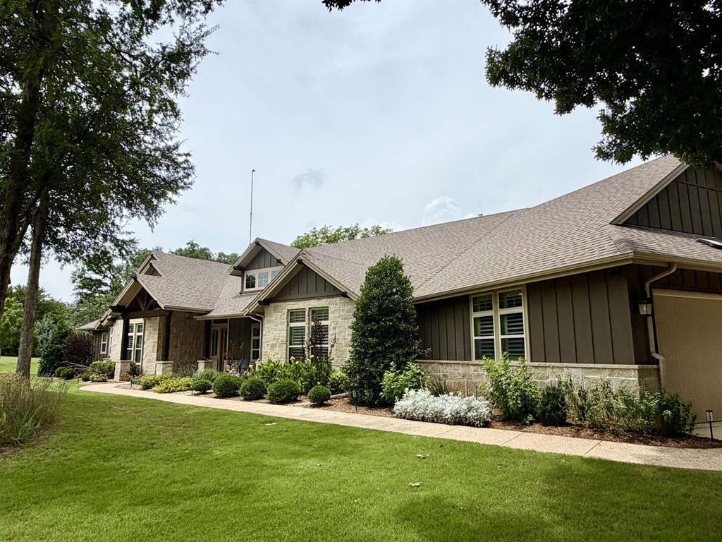 Stunning custom craftsman ranch on 3.72 wooded acres on a quiet cul-de-sac in Aubrey! Located outside city limits yet just 10 mins from grocery stores. This well thought out estate offers the perfect blend of privacy and convenience. Features 4 spacious beds, 3 full baths, and an extra-large 3-car garage. Inside, enjoy rich hardwoods, crown molding, designer lighting, and plantation shutters as well as granite countertops throughout. The chef's kitchen boasts a gas cooktop, extra drawer oven, and a convection microwave oven. Entertain effortlessly with a custom wet bar featuring a premium ice maker and beverage fridge. The large laundry room has extensive cabinetry, and it connects to the primary closet that also connects to the primary bedroom for added convenience. In addition, the extra-large primary closet has an island of dresser drawers. Outside, your private backyard oasis awaits with a sparkling pool, hot tub, 1 covered patio that overlooks the pool, and 1 uncovered patio where you can share a quiet dinner while listening to the resident owls “hoot”. Or, spend your mornings sipping your coffee on the covered front porch! Delight in the scenery: every room in the house has a view! Extras include a whole-house water filtration system and a hardwired exterior security camera system. Total luxury and peace of mind!