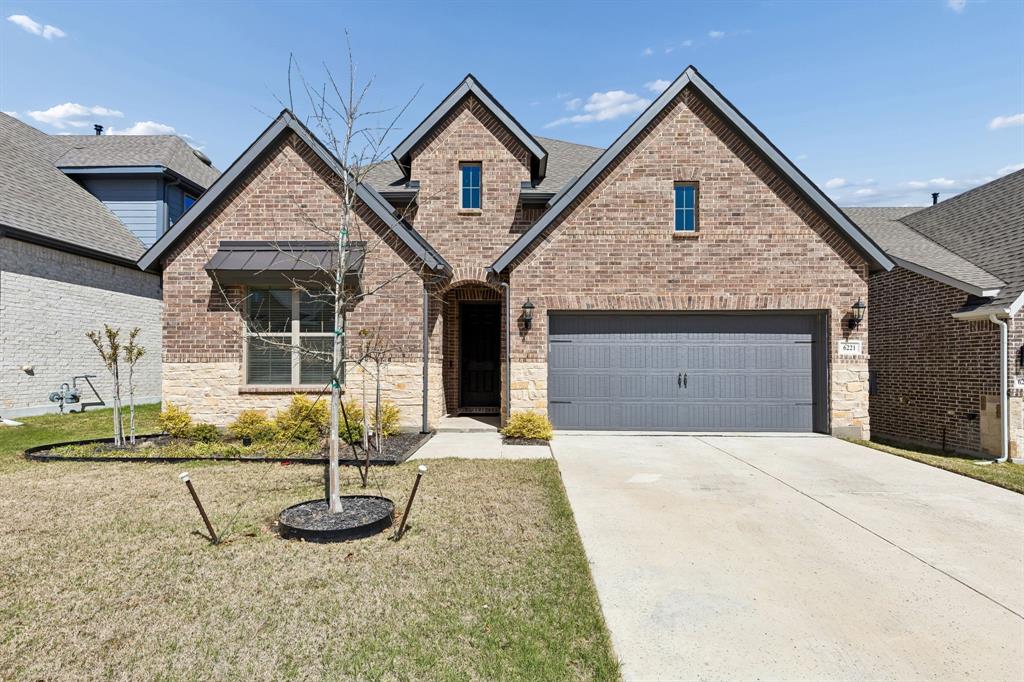 Discover this beautifully maintained David Weekley home offering 3 bedrooms, 2 full bathrooms, and a functional open-concept layout designed for both everyday living and entertaining. This south-facing home features a cozy yet spacious living area that seamlessly connects to a chef-inspired kitchen.

The kitchen is anchored by a huge quartz island, perfect for hosting, along with matching quartz countertops, a premium Monogram gas cooktop, and ample cabinetry for storage. A dedicated home office provides the flexibility for remote work or a quiet study space.

The private primary suite features a spa-like bathroom complete with a super shower upgrade and frameless glass enclosure, creating a clean and modern feel. Cottonwood Oak laminate flooring extends through the main living areas and into the primary bedroom, offering durability and style with no carpet in key spaces.

Step outside to a covered back porch with plenty of room to relax or entertain, while enjoying added privacy from rear neighbors. The backyard layout creates a peaceful outdoor setting that’s hard to find in many homes at this price point.

Located with quick access to Interstate 30, this home offers an easy commute to both Dallas and Fort Worth, making it ideal for buyers looking for convenience without sacrificing comfort.