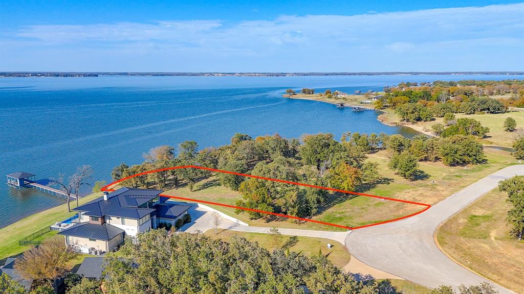PRICE DROP: $100,000 Price Reduction. Wake up to sparkling Richland Chambers Lake views on this beautiful 1 acre waterfront lot in the gated community of Admiral Shores. With approximately 117 feet of shoreline, this prime Texas lakefront property is ideal for your custom home, weekend getaway, or short term rental investment.

Located on one of Texas’ favorite fishing and boating lakes, this Admiral Shores waterfront lot offers a rare combination of privacy, recreation, and upscale lake living. The lot is cleared, gently sloping, and ready for your architect and builder to design the lake house you have been planning. Community build requirements include a minimum of 1,400 sq ft for a one story home and 1,800 sq ft for a two story, protecting neighborhood quality while still giving you flexibility in floor plan and style.

Whether you envision quiet mornings by the water, family weekends on the boat, or evenings watching the sun set over Richland Chambers Lake, this property gives you the setting to make it happen. Come claim your piece of shoreline and start building the waterfront lifestyle you have been dreaming about.