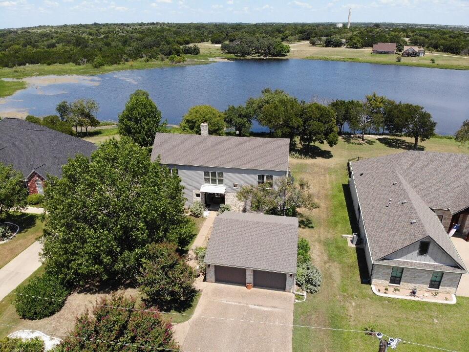This 3 bedroom, 3 bathroom lake side property located in White Bluff has many unique features. Walking through the front door of the home, you will notice the beautiful wood flooring throughout the home. In the living room there is a gas log stone fireplace. The large back patio features a lakeview and a fire pit. Seller will consider financing 80% of purchase price at 5% rate.
