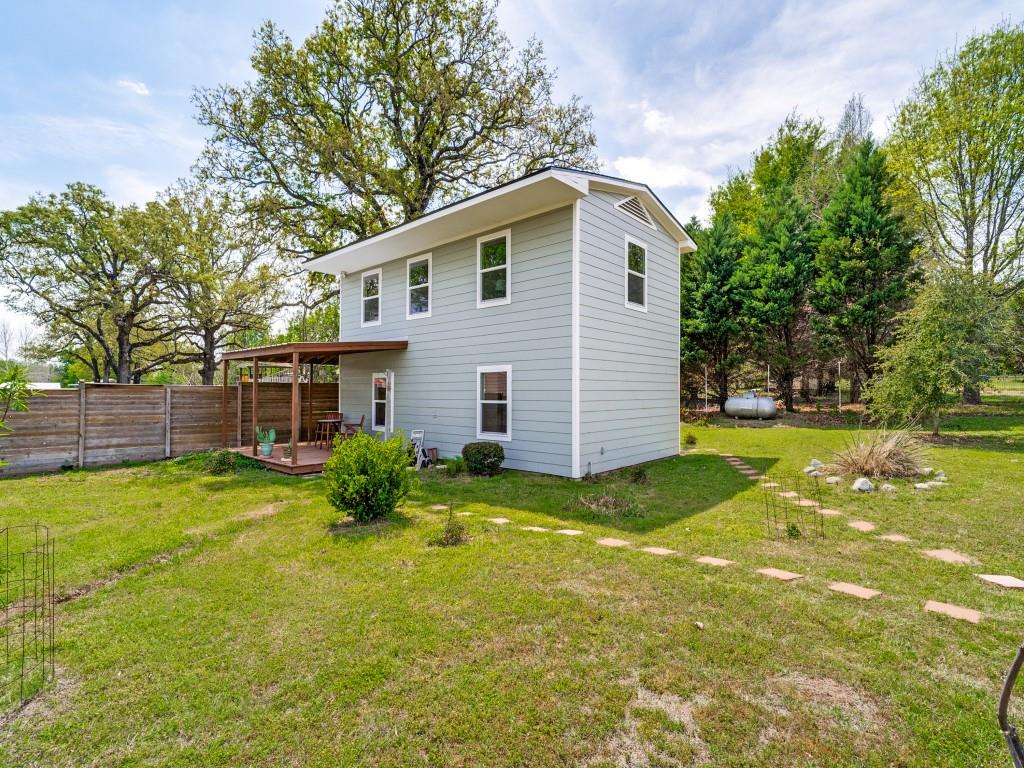Bring the family! One dedicated bedroom but the large loft will easily accommodate a king-size bed for adults, bunkbeds for the kids, or any combination that suits your needs! This charming two-story frame home is a perfect starter home for a small family, a low maintenance downsize or a weekend getaway for anyone wanting to enjoy the lifestyle of Granbury! Conveniently located within walking distance of the river and two miles from lakeside recreation with public swimming, a boat dock and large picnic area. The well-planned layout of this 1080 square foot home maximizes every inch of living space. The first floor has a full kitchen, roomy eating area and a family room for relaxing after a day at the lake. The second floor features hand-cut wood plank flooring, master bedroom, full bathroom and an ample loft area that can be utilized as a second bedroom, office, media or exercise room. Built by the current owner in 1992, recent upgrades include new roof, windows, Hardie Board siding (durable fiber cement), external wall insulation and paint. There's a large wraparound deck at the front and the oversized lot provides plenty of space for home expansion, secondary structures or a children's play area. All appliances will remain. This home is built to last and will provide many years of comfortable, affordable living!