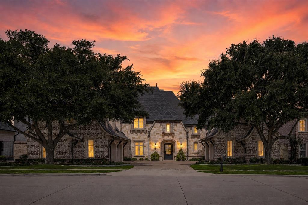 Back on market due to buyer’s inability to obtain financing, no fault of the property. Opportunity for a new buyer to secure this exceptional home. Inspired by timeless French Provincial architecture, this rare creekside custom estate in the prestigious Chapel Creek Estates of Frisco offers a blend of sophistication, craftsmanship, and livable luxury. Positioned on nearly half an acre along a picturesque creek, the residence captures both timeless elegance and modern refinement. A grand foyer with soaring ceilings, arched galleries, and a sweeping circular staircase introduces the home’s impeccable scale and symmetry. At the heart of the residence, the kitchen showcases a Wolf range, dual dishwashers, and custom cabinetry seamlessly flowing into the breakfast nook and family room with vaulted beamed ceilings and a stone fireplace overlooking the serene outdoor oasis. The first-floor primary suite is a true retreat, featuring a spa-inspired bath with dual vanities, soaking tub, two custom closets, a coffee bar, and private access to the pool terrace. A handsome paneled study with fireplace, wine cellar and bar, and theater room provide exceptional spaces for entertaining. Upstairs, a spacious game room with wet bar and balcony and secondary bedrooms, each with ensuite baths and walk-in closets, offering privacy and comfort for family and guests. Outside, the home transitions seamlessly to a resort-style retreat, complete with multiple covered and open-air living spaces, a stone fireplace, sparkling pool and spa, outdoor kitchen, and lushly landscaped grounds. Gather around the firepit beneath the canopy of mature trees and experience the tranquility of this private sanctuary. Located within Frisco ISD and just minutes from The Star, Legacy West, Shops at Legacy, and the Dallas North Tollway, this residence represents the pinnacle of luxury living in one of Frisco’s most coveted enclaves.