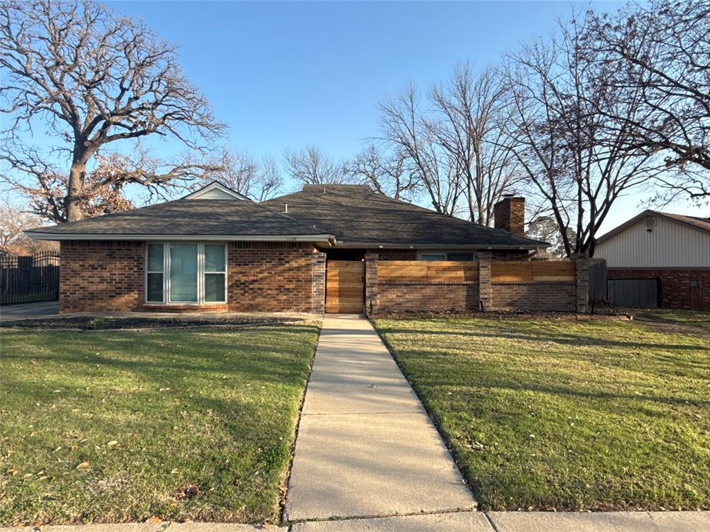 Welcome to2109 Oakmeadow St, a move-in ready one-story brick home in Bedford’s desirable Bedford Meadow neighborhood, with a low turnover. Offering 3 bedrooms and 2 updated baths, this home stands out with an exceptional price point and a price per square foot below competing homes currently on the market.

Inside, discover gorgeous wood floors and elegant tile flowing throughout — not a single inch of carpet in sight. The formal living room features a brick veneer fireplace and glass sliding doors opening to a private front courtyard. This space transitions seamlessly into the formal dining room, complete with a generous wet bar boasting white cabinetry and sleek black granite countertops.

The kitchen is a true showpiece with a center island, crisp white cabinets, black granite countertops, and stainless steel appliances including a gas stove. The primary bathroom elevates everyday routines with dual sinks, a sunken tiled shower, and a frameless glass door.

Outside, enjoy a small fenced backyard designed for low-maintenance living, complete with a stone patio and a charming storage shed. A long side driveway with a gate provides valuable extra parking for guests, hobbies, or additional vehicles.

Location is everything, and this home delivers. Enjoy nearby Bedford Bark Park for weekend outings, and zoned to the sought after HEB Independent School District schools. Easy access to 183, Blvd 26, and DFW Airport makes commuting a breeze and offering close proximity to shopping and dining options.

No HOA fees — just pure homeownership freedom. Schedule your showing today!