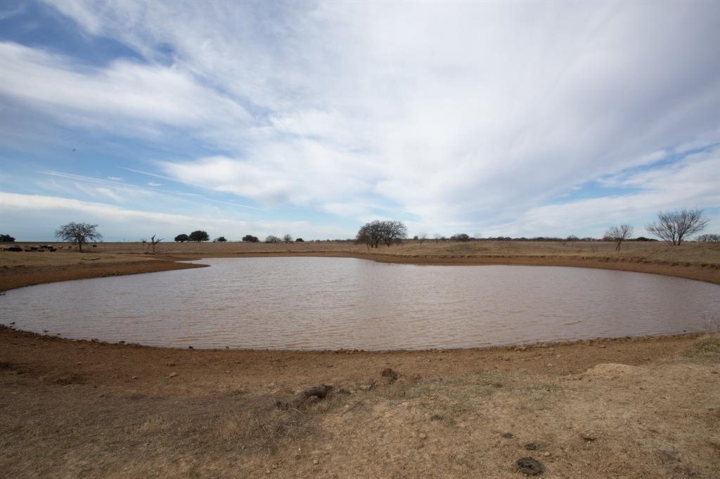 If you are looking for a great piece of property this one has it all: hunting, grazing, recreation, hay, and wheat. There are eight stock ponds, five large and three smaller ones which are used for livestock water. Cross fences are set up for a great rotational grazing system. There are good fertile (Sagerton loam) soils on the tillable land. This property has a good wheat base acres. The improved pastures consist of Coastal bermuda and Kleingrass that can be grazed or hayed. Part of the native rangeland has been reseeded to a mixture of grasses. Electricity runs through the property. Scattered liveoaks are in the front part of the property. The back part is dense with postoaks and mixed brush making it great for hunting deer and turkey. This property has a good set of working livestock pens. Located just .25 mile of off Hwy 380. Don't let this versatile property slip away.