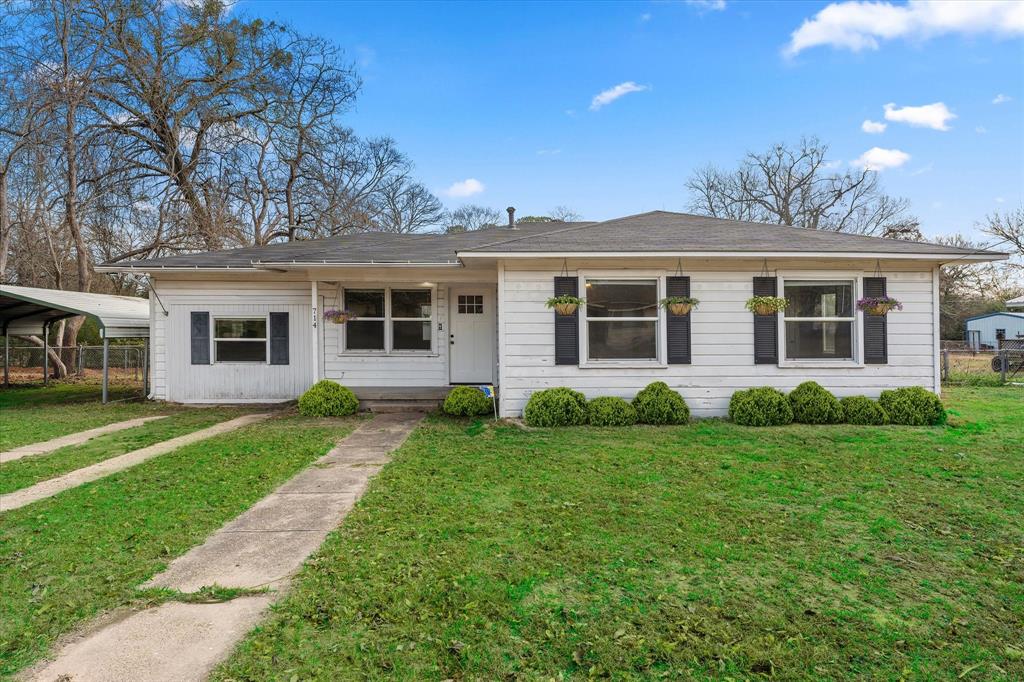 This cute 3-bedroom, 2-bath is ready for the next family or someone that is just starting out in the heart of Quitman, Texas. With 1,462 square feet of living space situated on an almost half-acre lot, the property combines space, functionality, and location. The home features a converted garage that serves as a versatile multi-purpose room, ideal for a second living area, home office, game room, or flex space—adding valuable usable square footage. A fully fenced backyard provides privacy and ample room for outdoor living, pets, or future enhancements. Conveniently located near shopping, dining, and the local hospital, this property offers everyday accessibility while maintaining small-town charm. Its proximity to Tyler and reasonable access to the DFW metro area make it attractive to long-term tenants and commuters alike.