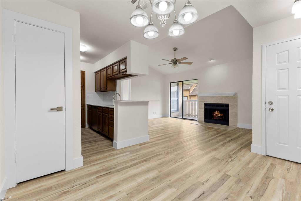 Updated second-floor condo in The Cloisters featuring fresh flooring, fireplace, private balcony, in-unit laundry, updated counters, stainless steel appliances, and great cabinet storage. 

Refrigerator, washer, dryer, and microwave are included, making this condo truly move-in ready. 

The kitchen offers a pass-through opening to the living area, giving the space an open feel. Community amenities include pools, tennis courts, and landscaped common areas. 

Convenient Arlington location near the entertainment district, AT&T Stadium, Globe Life Field, dining, shopping, and major highways. Vacant and ready for its next owner.