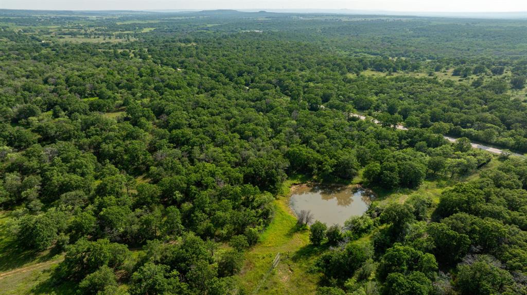 Ammons Take 2 - High Fence Ranch........Seller has made new roads and completed lots of Clearing.
This is a one-of-a-kind property with 503 acres in total, 434 of which is under High fence, and the remaining 69 acres is under low fence, east side of the Creek. The house speaks for itself, Beautiful Kitchen, Fireplace, Game Room in the Loft. Covered Porches and Carport, Storm Cellar. This Ranch has 9 ponds, most have fish and have made it through the last drought. Awesome Hunting!!! Over a mile of lost creek, very pretty bottom ground. Lots of Giant Moss Rocks throughout the property. There are roughly 90 acres of cultivated open fields. These fields are Cross fenced to keep livestock rotating. This ranch is very cattle friendly around the entire 434 acres, with a 30 FT lane between low and high fence, for easy gathering of livestock. Lots of tree cover, Plentiful in post oaks,Elm, and various hard woods. The road system runs right through the entire ranch. This is a Diverse Ranch that will not Disappoint. Inquire about Animals and Exotics... RING US TODAY!