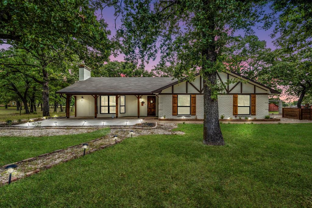 Motivated Seller! This meticulously maintained gem exudes timeless charm in every detail! Passing through the gated entrance you will step into country life & tranquility! Take a stroll inside to see LVP flooring throughout, wood shutters, built in cabinets in the LR, electric fireplace & custom ceiling fan. The spacious dining room & adjacent kitchen features granite counter tops, copper sink with disposal, updated light fixtures, under mount lighting & all new appliances! The breakfast area has a built in hutch with wine storage. Just off the kitchen you will find a half bath and full size utility room. The secluded office is conveniently located nearby. In addition, you will discover the sunroom with it's captivating view of the stocked pond! Discover the serenity of the primary bedroom & bath! Bedrooms 2 & 3 have a view of the front of the house & adjacent to the updated 2nd bath. 30x55 workshop with electric, RV pad with sewer hookup, 2 barns with electric & water available. Fenced & cross fenced!