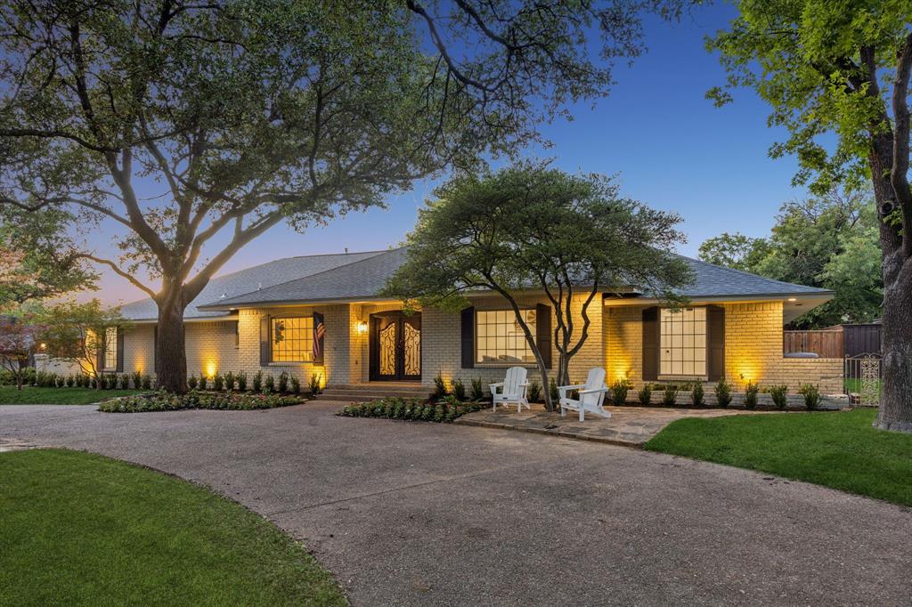 This quintessential Northwood Hills home has been thoughtfully reimagined from top to bottom, blending timeless architecture with today's most desirable finishes and an open, functional floor plan. Set behind a circular driveway with exceptional curb appeal and mature trees, this fully remodeled residence makes a lasting first impression before you even step inside. Beautiful hardwood floors extend throughout the home, leading to a private office, a formal dining room, and two spacious living areas designed for gathering with family and friends. One living room is anchored by a fireplace, while the open-concept layout flows seamlessly into the heart of the home. The beautifully appointed kitchen features a large island, abundant cabinetry, and a spacious butler's pantry offering exceptional storage and prep space. Just beyond, the laundry room is complemented by an additional full bathroom for added convenience. The floor plan includes five bedrooms and four full bathrooms, providing flexibility for families and guests alike. The primary suite is a peaceful retreat with direct access to its own backyard deck and a beautifully remodeled ensuite bath featuring a soaking tub, a walk-in shower, and a generous walk-in closet. Two secondary bedrooms share a well-designed Jack-and-Jill bathroom, another enjoys its own private ensuite, while the fifth bedroom is thoughtfully situated on the opposite side of the home, creating a private retreat that's ideal for overnight guests. The backyard offers a large grassy yard with plenty of room to play, entertain, or simply enjoy the outdoors. A gated rear fence provides privacy, while the private deck just off the primary suite creates a peaceful place to enjoy your morning coffee.
Blending timeless Northwood Hills character with a complete, high-quality renovation, this exceptional home offers generous living spaces, designer finishes, and a location in one of Dallas's most beloved and established neighborhoods.