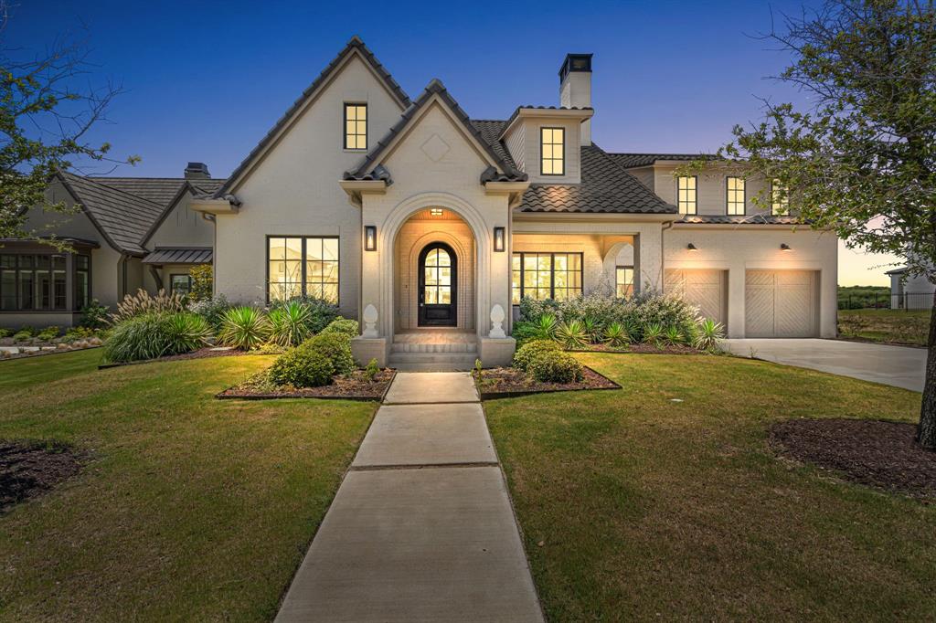 Experience refined luxury in this exceptional new construction residence located within the gated, 24-hour guarded Montrachet community. Thoughtfully designed with timeless style and elevated finishes throughout, this home offers a seamless blend of elegance, comfort, and everyday functionality. A formal living room flows effortlessly into the open-concept kitchen, dining, and family areas, creating an ideal layout for both entertaining and daily living. The chef’s kitchen features top-of-the-line appliances, a large center island, and generous prep and gathering space, while the adjacent dining area is enhanced by a built-in buffet for added style and convenience. The family room offers custom built-ins for media storage and display, bringing both organization and architectural interest to the space. The first-floor primary suite serves as a private retreat with a sitting area and a luxurious spa-like bath. An additional ensuite bedroom on the main level provides flexibility for guests, multigenerational living, or a private office. Upstairs, two ensuite bedrooms with walk-in closets are complemented by a versatile bonus room, perfect for a game room, media space, fitness area, or additional living space.