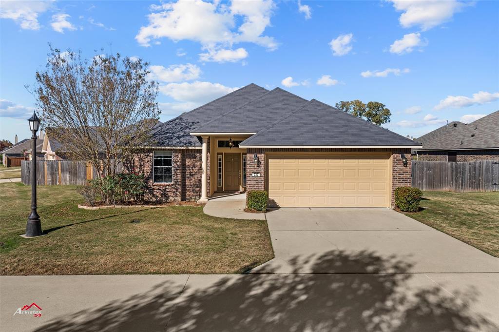 What a fantastic opportunity to own a piece of one of the quiet gated community in Shreveports Business corridor, hospitals, LSUS, and all the best of Shreveport while close to 49! Its inviting open floor plan invites all the friends and family to be part! The tile flooring allows easy clean up and allergen free living!  The kitchen is a cooks delight with gas range, granite countertops and even the refrigerator washer and dryer are a bonus to be included!  The king sized master makes every morning a fabulous one, and waking in the bright master oasis with garden soaking tub or stall shower.  The large walk in closet makes getting ready in the morning an easy one to find the perfect days outfit to feel great!  This is a corner fenced yard for the kids and pets with playground, easy walkable neighborhood too!