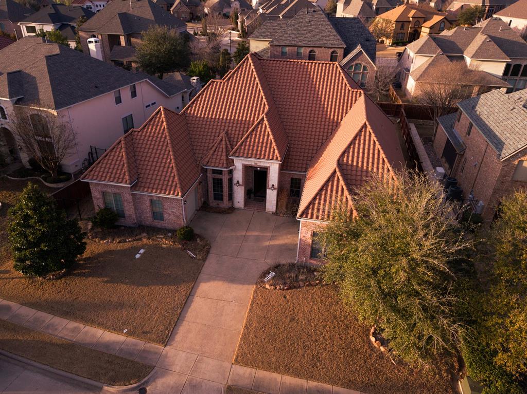 Located in the highly desirable Saddleridge Estates in Allen, this semi-custom one-story home by Toll Brothers offers approximately 3,865 sq ft on a 0.275-acre lot. Designed with both comfort and functionality in mind, the home features high ceilings and an open layout that creates a bright and inviting atmosphere. The spacious living area includes a gas log fireplace, making it ideal for everyday living and gatherings.
The split floor plan provides added privacy, with the primary suite separated from the secondary bedrooms. A versatile fifth bedroom offers flexibility for use as a home office, media room, or additional living space, and is pre-wired with a projector. The kitchen serves as a central hub with a large extended island and abundant cabinetry equipped with built-in lighting.
The backyard offers ample space for outdoor enjoyment and includes an extended covered patio, perfect for relaxing or entertaining. Conveniently located with easy access to Highway 121 and US-75, and close to shopping, dining, Allen Premium Outlets, and local schools.