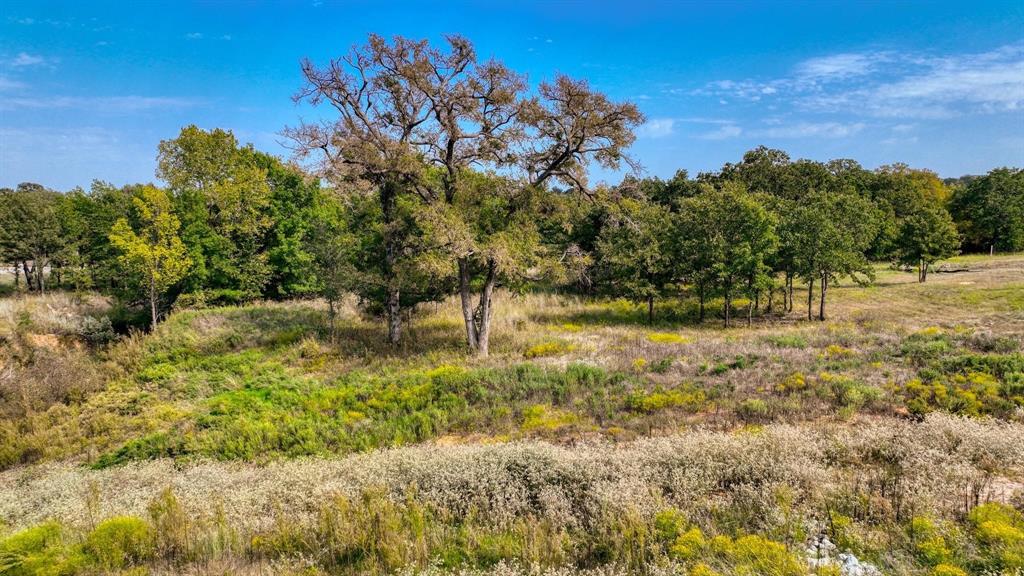 Come build your dream home at the Ranches of the Valley WEST. on this 1.542 acres is a perfect spot! With breathtaking blend of scattered trees, native grassland with a gently sloping terrain. At the back of the property there is a creek that meanders through enhancing the peaceful treat that will be in your backyard. Deed and build restrictions a minimum of 1,800 square foot home. With Electric available at the road and have the option to install your own well or connect to Walnut Creek Co-Op Water. A septic system will be needed but there is Nextlink Fiber Internet that is available. DO NOT Miss out on this fabulous property