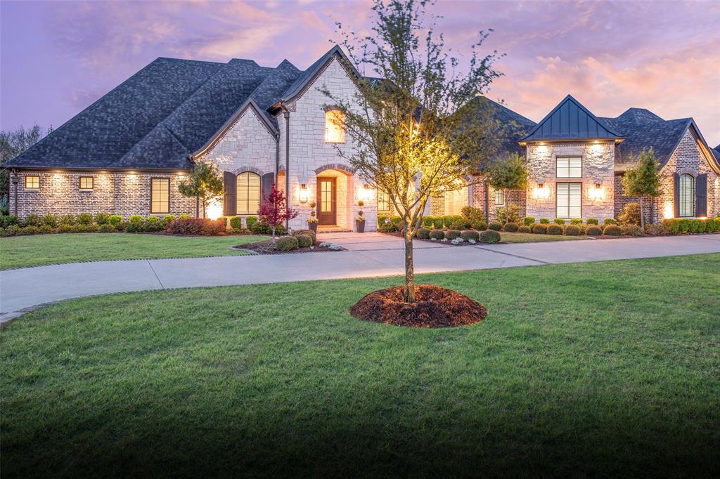 This stunning single story, custom built home is nestled on a premier creek lot offering an oasis of tranquility.  Built with the luxury owner in mind, the technology, security and equipment automation will be appreciated by any new owner.  If you work from home, the 2 private offices will likely be a welcome addition with plantation shutters and views of the front of the property.  Each of the 5 bedrooms features an ensuite bathroom with 2 additional half bathrooms for guest convenience.  The media room features stadium seating, a Sony 4k projector, 10 speakers, 2 sub woofers and 1 center channel with a Screen Innovation 5 series 120 in fixed screen.  The workout room at the back of the house includes rubber flooring and a full wall mirror. The chefs kitchen has Thermador appliances throughout that include a 48in pro range top, double ovens, built in microwave, built in fridge and freezer, and under cabinet wine fridge. With quartz countertops, a 48in Faber pro series vent hood and a reinforced pantry that doubles as a safe-tornado room, the luxury kitchen opens to the family room with views of the back patio.  The focal point of the family room might be the gorgeous chandelier, the 42in True Direct gas fireplace, or the wood beams across the ceiling.  Sliding doors provide access to the oversized back patio that can be screened in for additional time enjoying the outdoors. The patio features a fireplace, built in gas grill, sink and fridge as well as sonance sound system with sub woofers that connects to the control4 system.  Travertine floors provide access to multiple patio levels for entertainment at the pool, fire pit or even creek access.  Other features include Pella windows, 2 inch spray foam insulation on ceiling joists with R38 blown insulation, 2 Lennox high efficiency 16 seer dual zone system, automated window treatments, luma surveillance cameras, backup generator, hidden storage as well as a 22 x 15 foot storage room above the garage.
