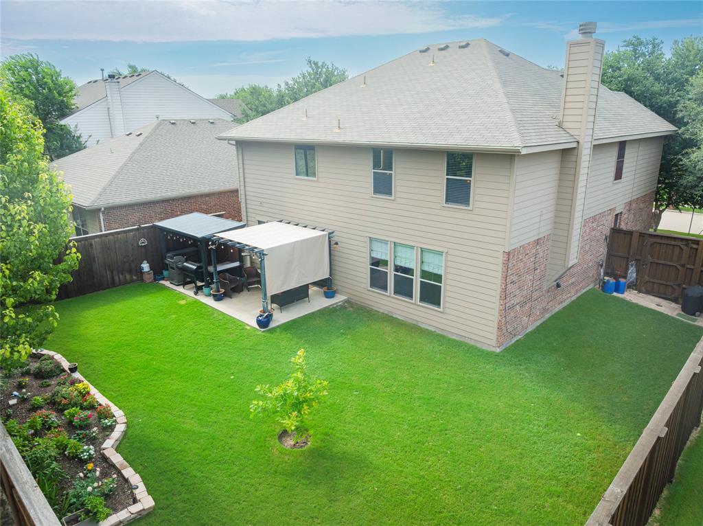 Welcome to this immaculately maintained McKinney jewel! Perfectly situated on a premium corner lot within a beautifully established neighborhood and the highly desired Frisco ISD, this move-in-ready home seamlessly blends elegance with everyday functionality. The thoughtfully designed with above average upgrades. the main level features a dedicated home office adjacent to the formal dining room, setting a perfect stage for both remote work and entertaining. At the heart of the home, a warm and inviting family room showcases a cozy fireplace and flows effortlessly into the open-concept kitchen. The chef’s space is fully equipped with granite countertops, a center island, a premium gas range, an eat-in dining area, and a convenient built-in study nook. Storage is exceptionally abundant, highlighted by dual pantries—including an expansive secondary pantry housed within the oversized laundry room, complete with extra cabinetry and dedicated space for a box freezer.
Upstairs, the highly desirable floor plan tucks away all of the generously sized bedrooms, including a massive primary suite that serves as a private retreat with a dream walk-in closet.  You'll also discover there is enough living space for a study, music room or exercise space that separates 3 of the 4 bedrooms. The Primary Bathroom has two 24 x 32 dimmable lighted mirrors. The Guest bathroom showcases a 24x40 lighted mirror as well.  Must see to love!  See documents for specs and cost of the smaller mirrors. 
Step out back to relax on the covered patio, overlooking a beautifully kept yard with lush green grass. Practical, high-value upgrades elevate the home, including a water softener and built-in garage storage shelving. Enjoy an incredibly easy commute in every direction with quick access to Highways 75 and 121, all while being zoned for the highly sought-after Frisco ISD.