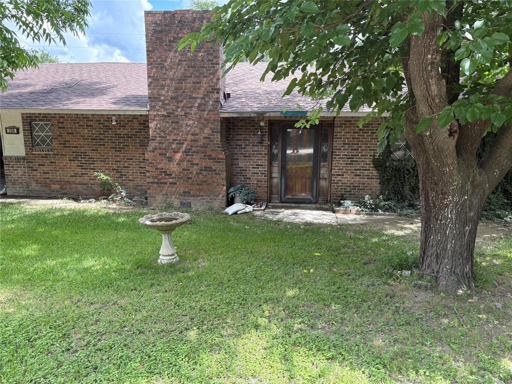 This 1680 sq ft home on .918 acres is ready for you to make your own! This property in includes 8 lots totaling almost an acre, as well as a large shop and tall covered area perfect for any hobbies or interests you may have. It is fully fenced around the home with plenty of extra space. If you've been looking for an opportunity to put your own touch on a great piece of property, this is it!