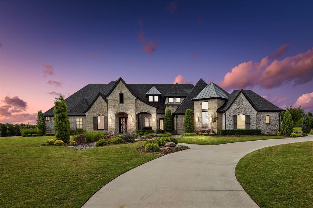 *Please View Video* Situated in prestigious Barry Farms, this stunning 6-bed, 6.2-bath home raises the bar w detailed craftsmanship, impeccable quality, and timeless design. Built by J. Anthony, this custom home enjoys outdoor views from almost every room, including your study w built-in shelving and a library ladder. Pamper yourself in a spa-inspired owner’s suite designed for relaxation. Both your game room and home theater are downstairs, w refreshments in a conveniently placed bar. At the back of your home, your welcoming living room is open to your kitchen and dining. A wall of windows slides completely open, allowing a seamless flow between your indoor and outdoor living. Travertine pavers create a huge covered patio that houses your outdoor table and a cozy seating area anchored by a fireplace. Beyond, your sparkling pool and a fire table beckon invitingly. With professional landscaping, vaulted ceilings, hardwood floors, and more, this home sets the standard for elegant living.