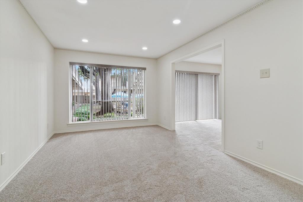 HOA DUES INCLUDE ALL UTILITIES, exterior maintenance, grounds upkeep, and common areas. GREAT LOCATION! UPDATED! ALL NEW APPLIANCES INCLUDING WASHER AND DRYER! FRESH PAINT AND NEW CARPET! Not only is this condo secluded, it is also centrally located with easy access to Central Expressway. This downstairs unit has it all, pool view and courtyard! This well-maintained 1 bedroom, flex room with closet, plus 2 bath unit offers incredible storage space and the convenience of an assigned covered parking spot, a true bonus in this area. The pool area is gated and centrally located in the complex along with a charming courtyard, perfect for relaxing or hosting gatherings. The kitchen also has new butcher block  countertops and appliances including a cooktop, built-in oven, vent hood, dishwasher, washer and dryer. The primary bedroom offers an abundant walk in closet space. The dining, living area add charm and functionality. Ample on street parking is available right outside for your guests, and bike trails offer a great way to stay active just right outside your door. This prime location offers easy access to Highway 75, 635, and 190, and is just minutes from top destinations like NorthPark Center, Mockingbird Station, Highland Park Village, and Preston Hollow Village. Restaurants, retail, and shopping are all at your fingertips!